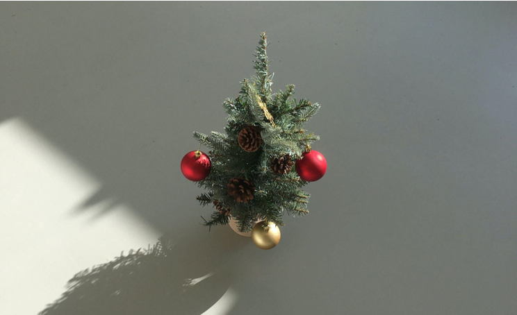 Bring the Garden Indoors with Slim Artificial Christmas Trees and Live Greenery